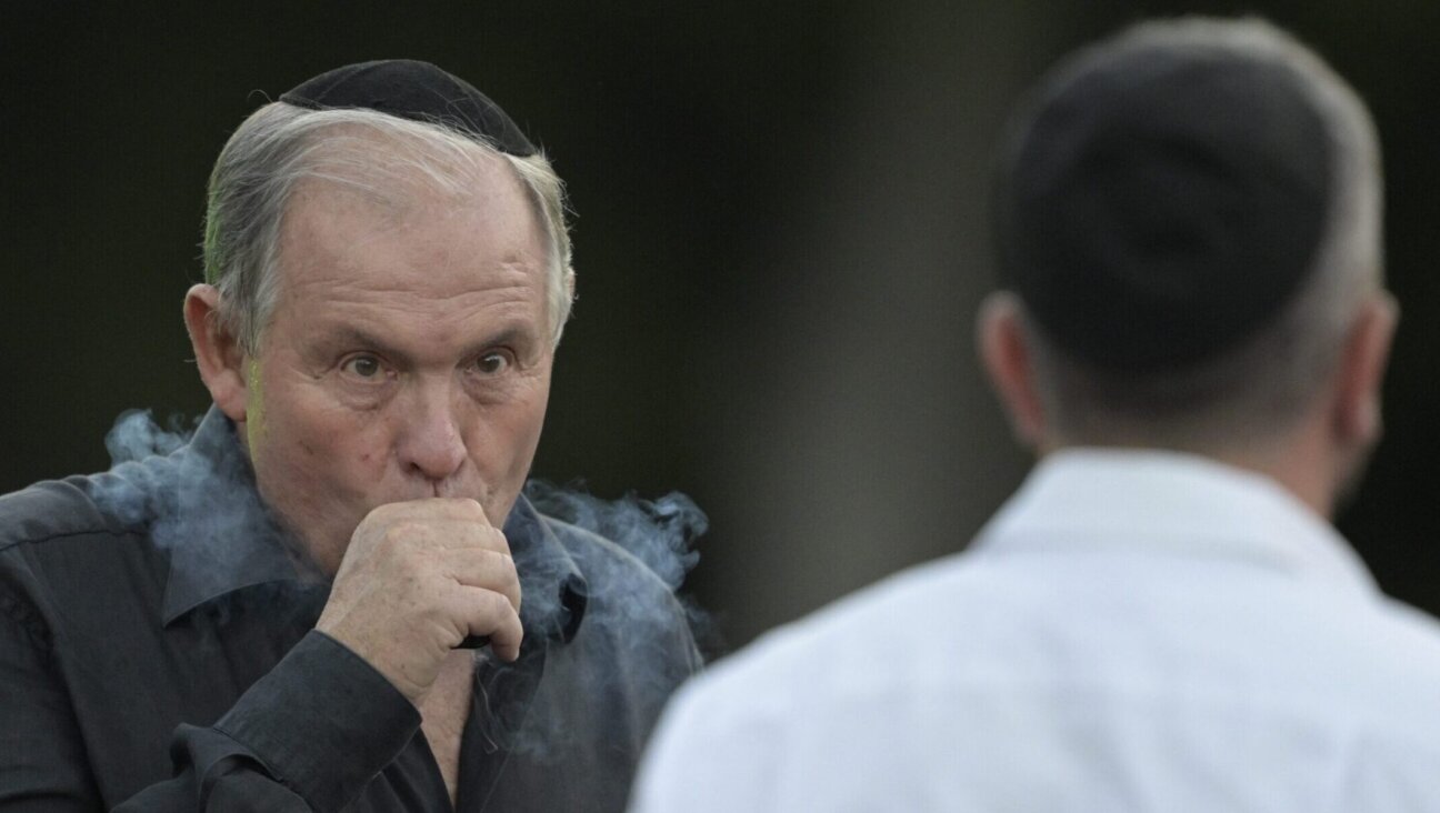 Gerardo Werthein, then Argentina’s ambassador to the United States, vapes during a Hanukkah celebration in Buenos Aires, Dec. 12, 2023. (Juan Mabromata/AFP via Getty Images)