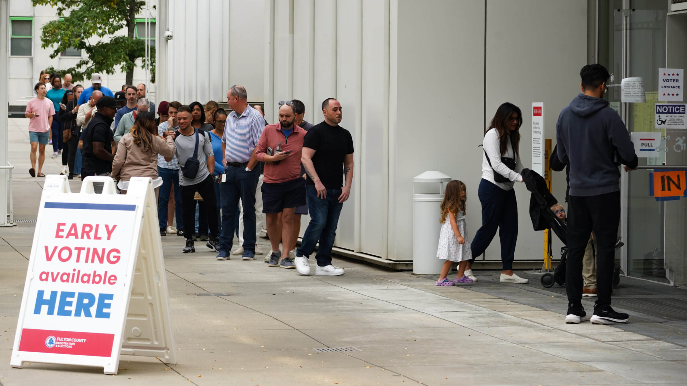 Voters head into a polling location to cast their ballots on the last day of early voting for the 2024 election on November 1, 2024 in Atlanta.