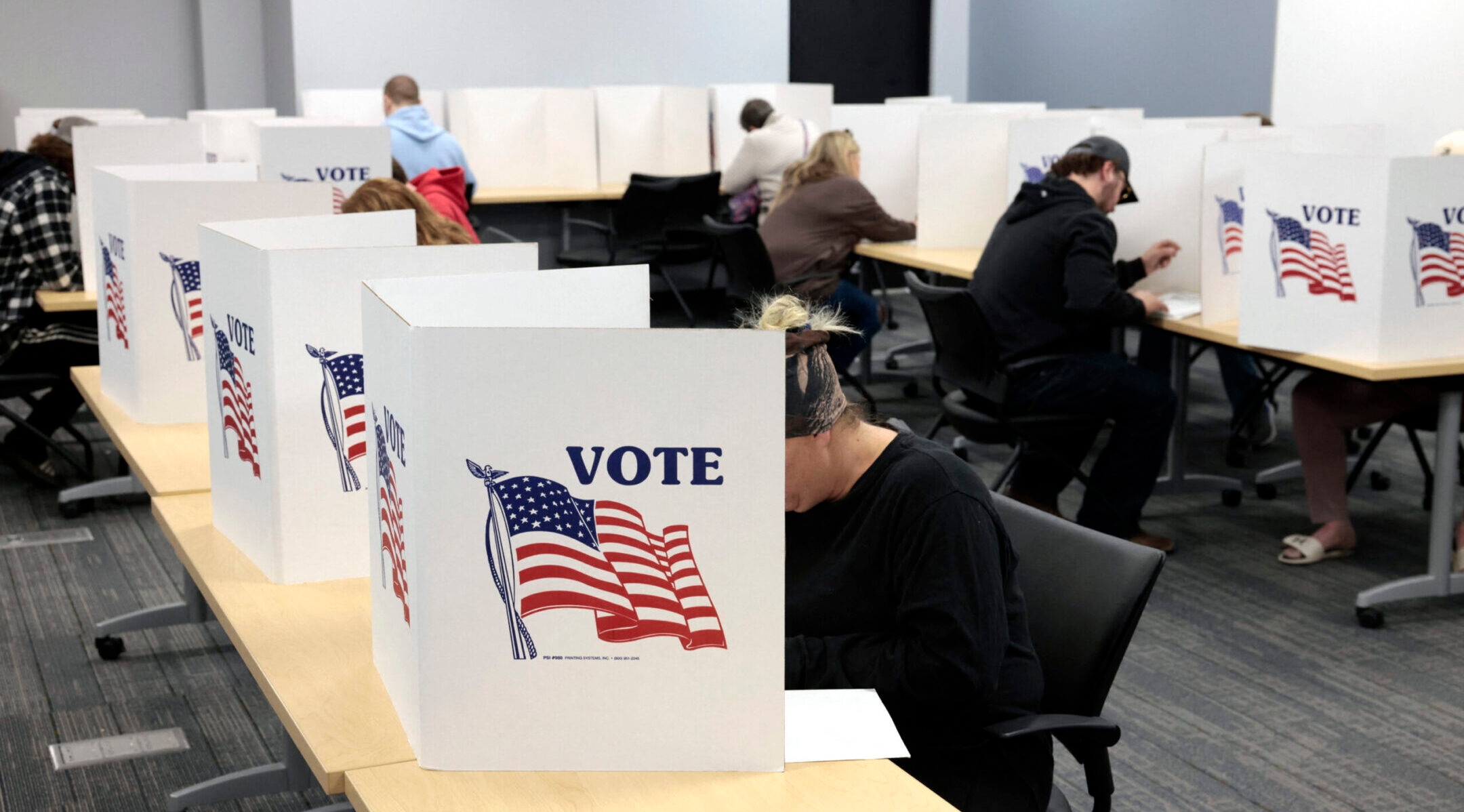 People cast their ballots on the last day of early voting for the general election in Howell, Michigan, Nov. 3, 2024. (Jeff Kowalsky / AFP via Getty Images)