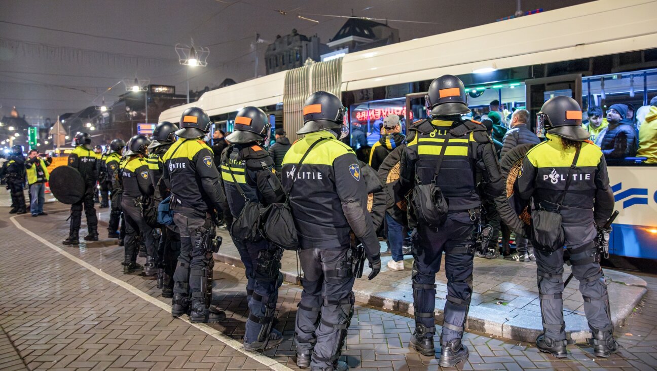 Dutch Police stand guard after attacks on Israeli fans following the soccer game between Ajax and Maccabi Tel Aviv in Amsterdam on Nov. 8, 2024. (VLN Niews / ANP / AFP)