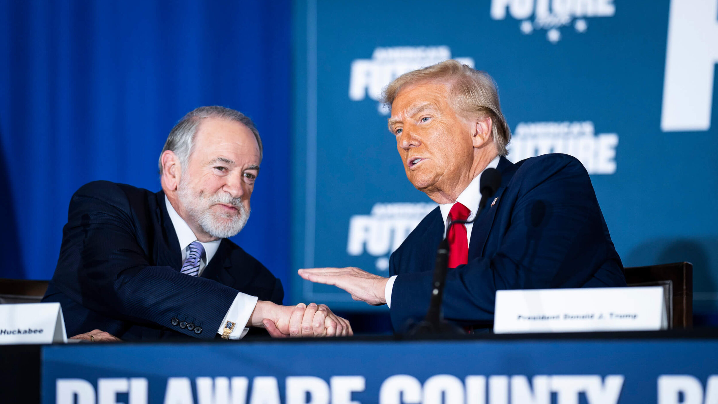 Mike Huckabee speaks with President-elect Donald Trump in October. 