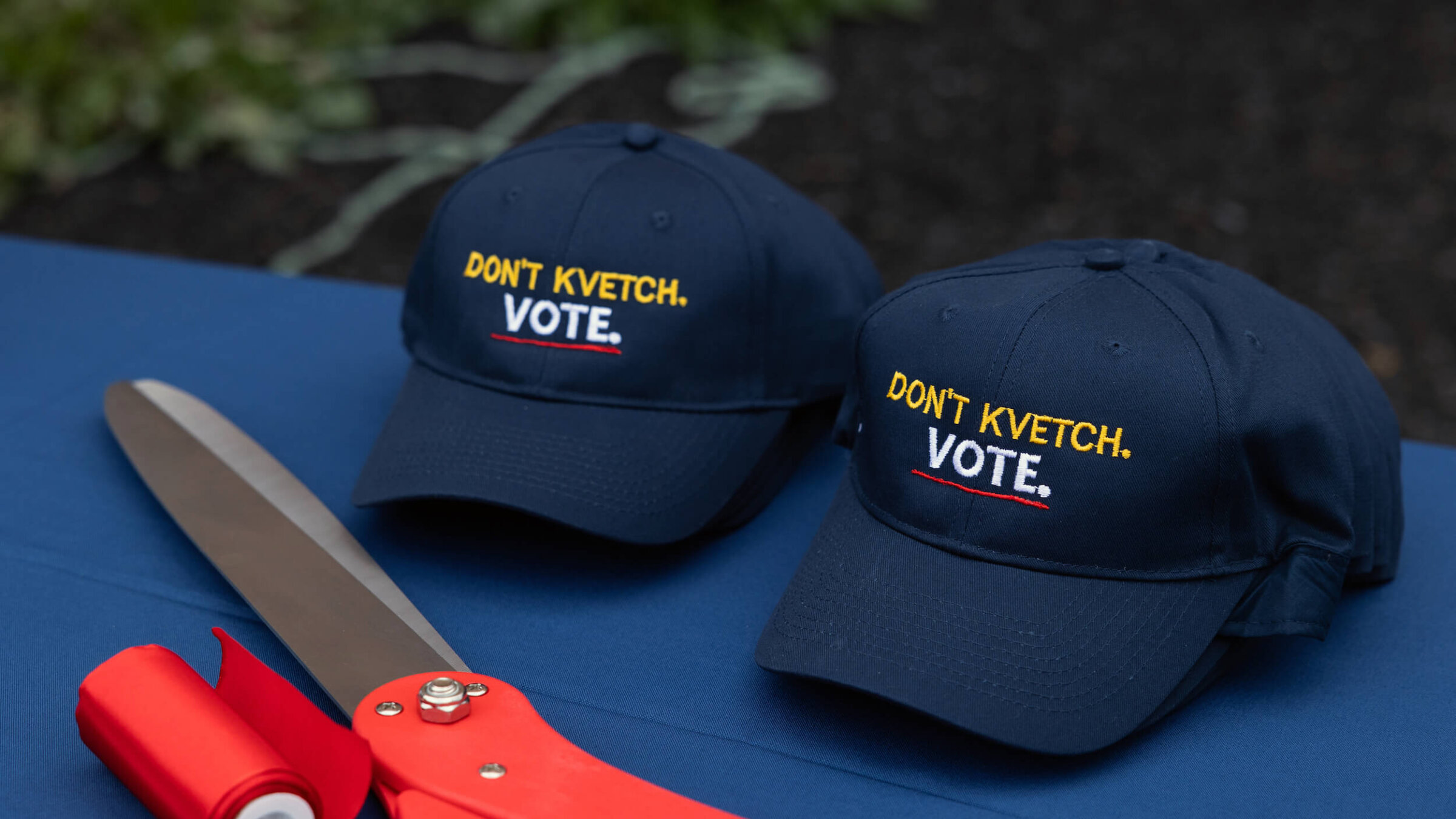 Baseball hats are embroidered with the phrase "Don't kvetch. Vote." at a Jewish Get Out The Vote center in Pennsylvania. 