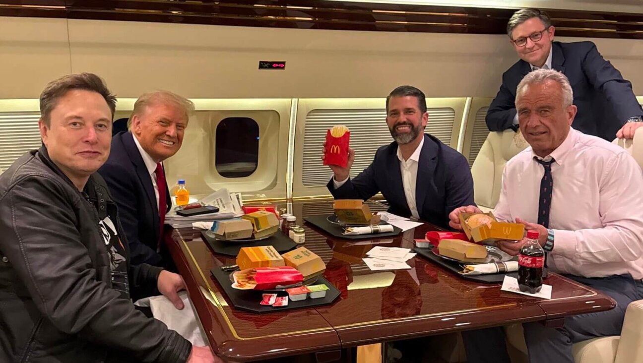 Trump and some of his newly appointed leaders — Elon Musk and RFK Jr. — eating McDonald's.