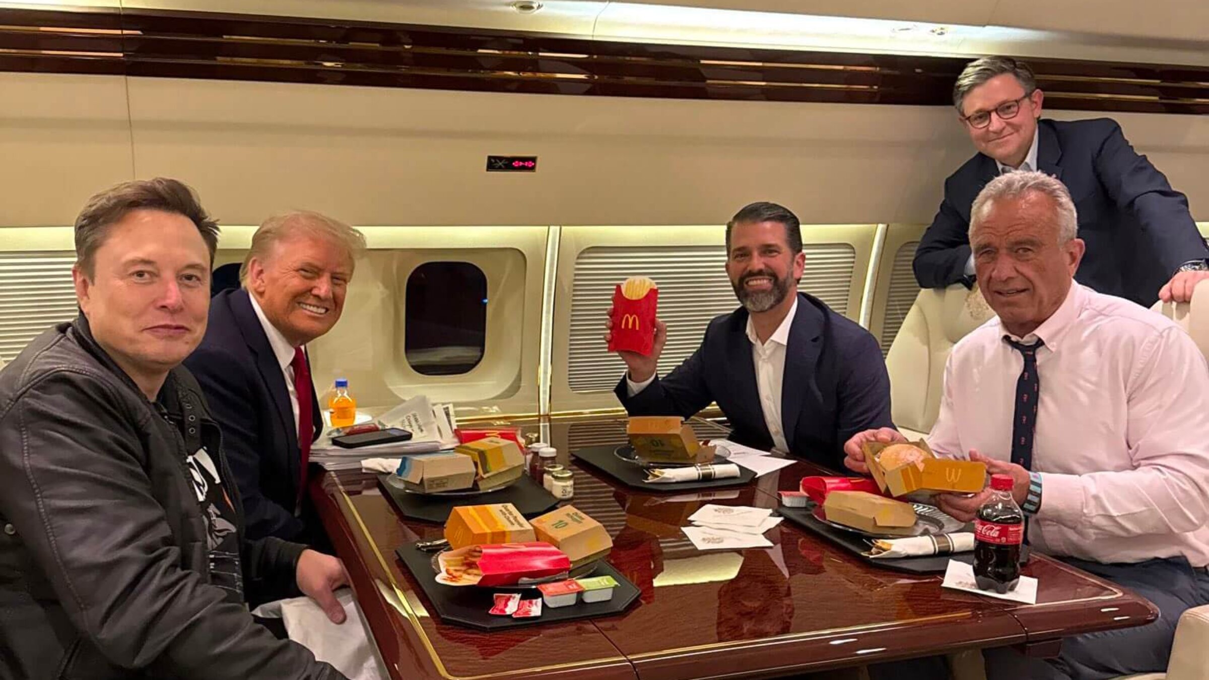 Trump and some of his newly appointed leaders — Elon Musk and RFK Jr. — eating McDonald's.