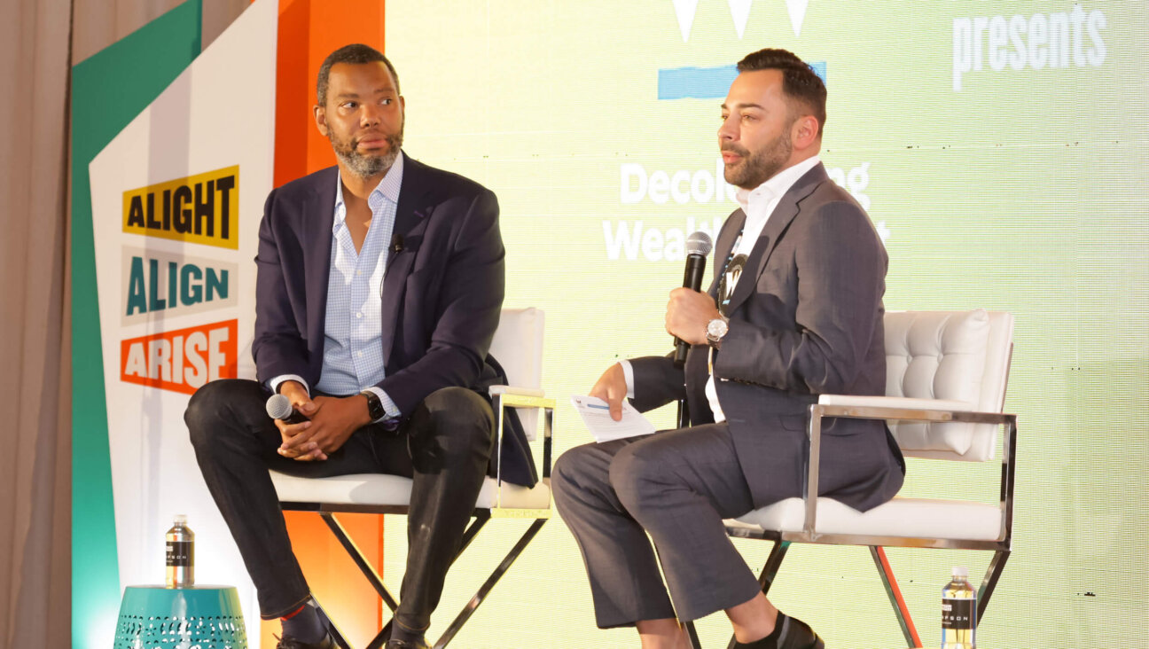 Ta-Nehisi Coates (left) and Edgar Villanueva (right), founder of the Decolonizing Wealth Project, speaking in June, 2023. 