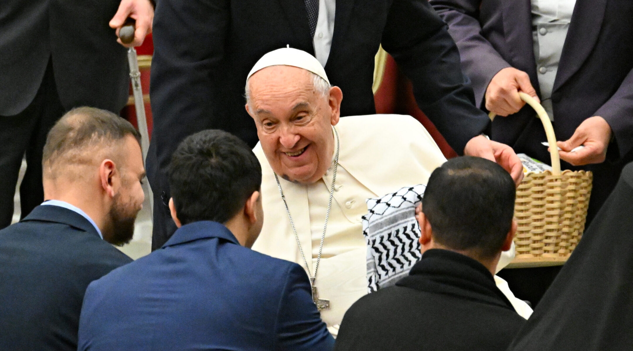 Members of the Palestinian embassy to the Holy See give a keffiyeh, a traditional Palestinian scarf, to Pope Francis during a Christmas ceremony at St Peter’s Square at the Vatican, Dec. 7, 2024. (Andreas Solaro/AFP via Getty Images)