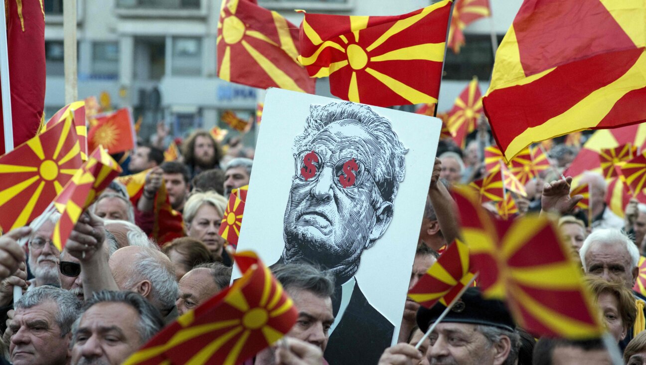 George Soros, depicted on a poster at a demonstration in Macedonia in 2017, is among the targets of the Heritage Foundation's Project Esther.