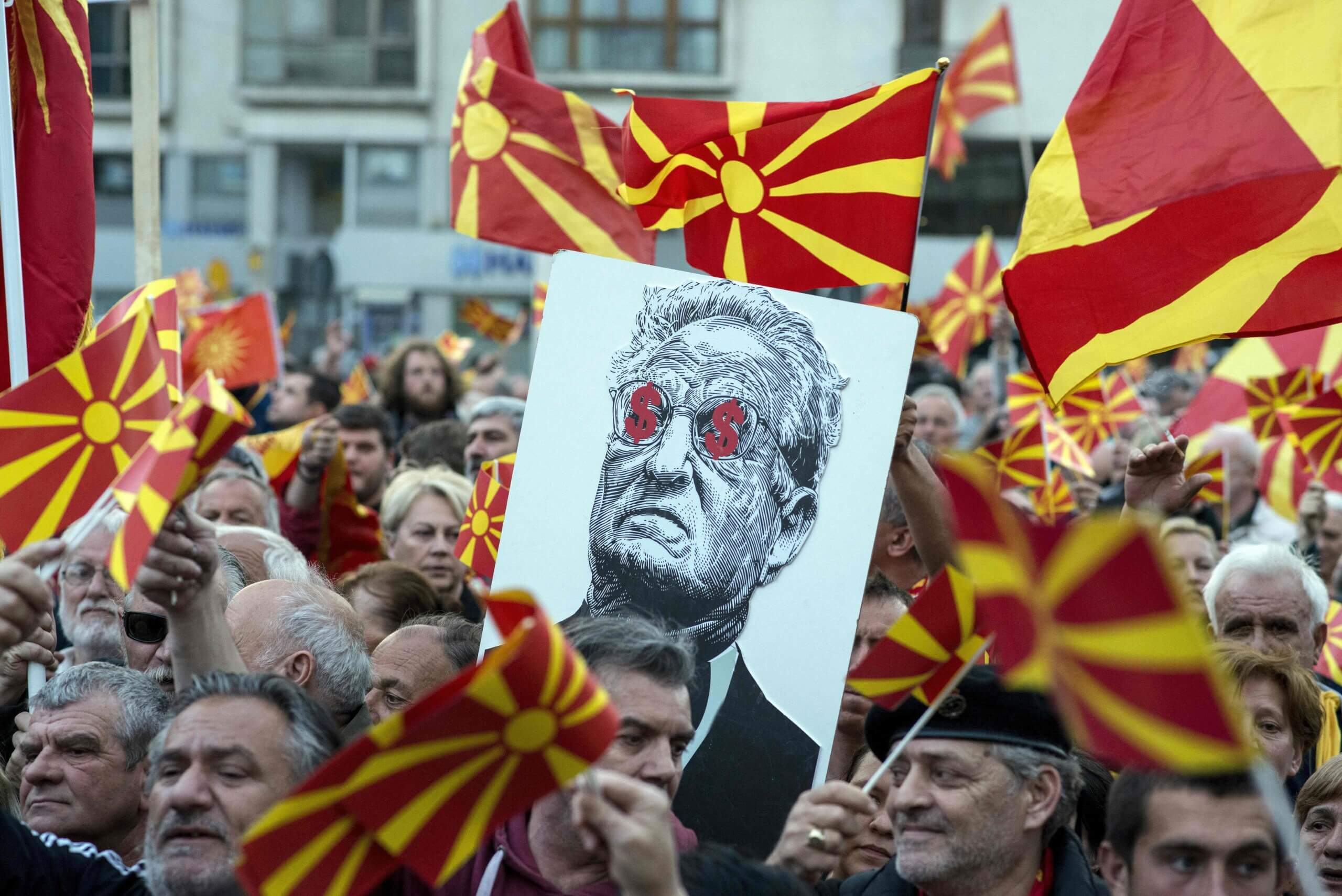 George Soros, depicted on a poster at a demonstration in Macedonia in 2017, is among the targets of the Heritage Foundation's Project Esther.