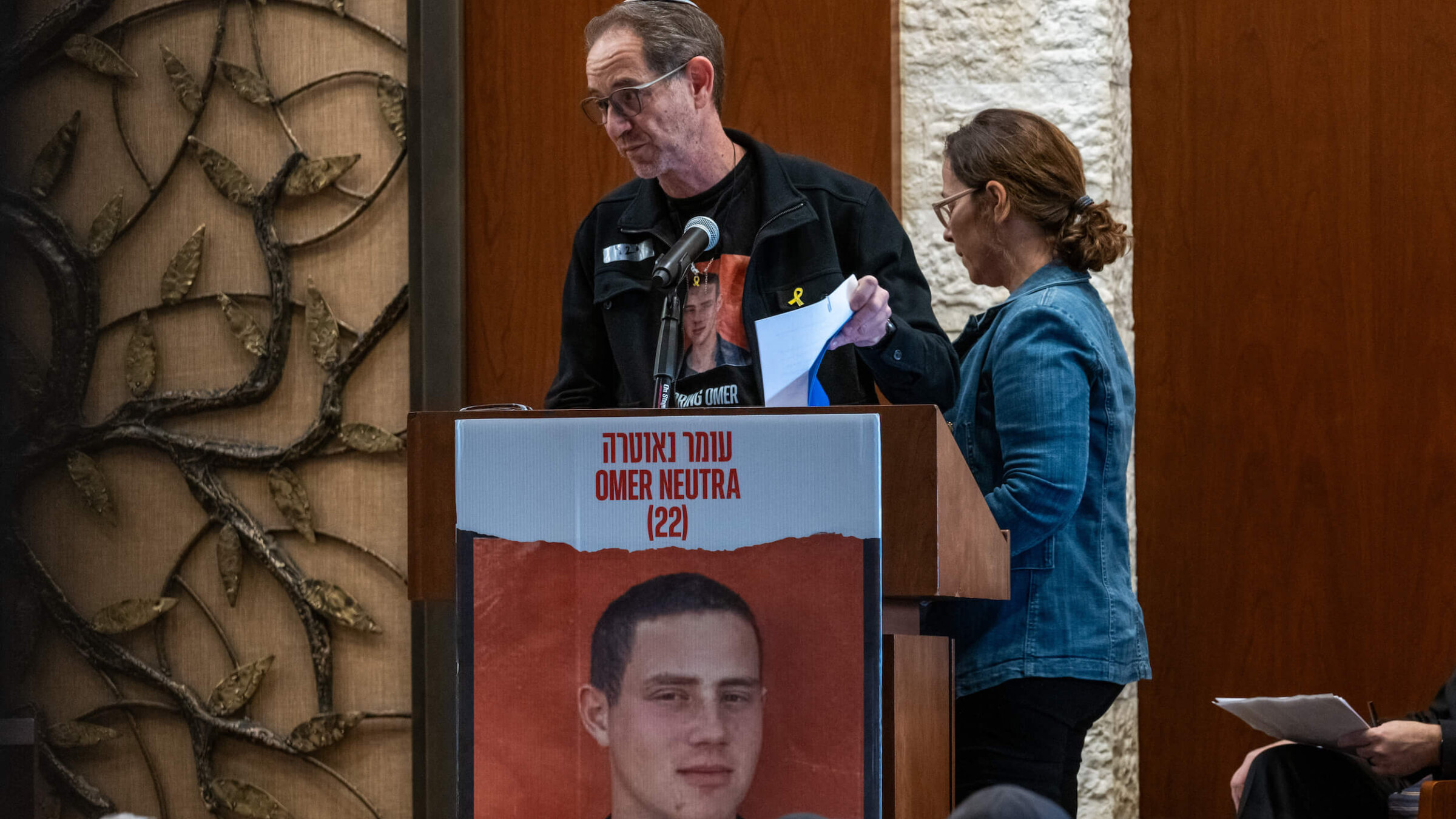 Orna and Ronen Neutra, the parents of Omer Neutra, speak at the Midway Jewish Center on Long Island during a memorial service for their son, a fallen Israeli American soldier now known to have been killed on Oct. 7, 2023. Neutra's body is currently being held in Gaza. 