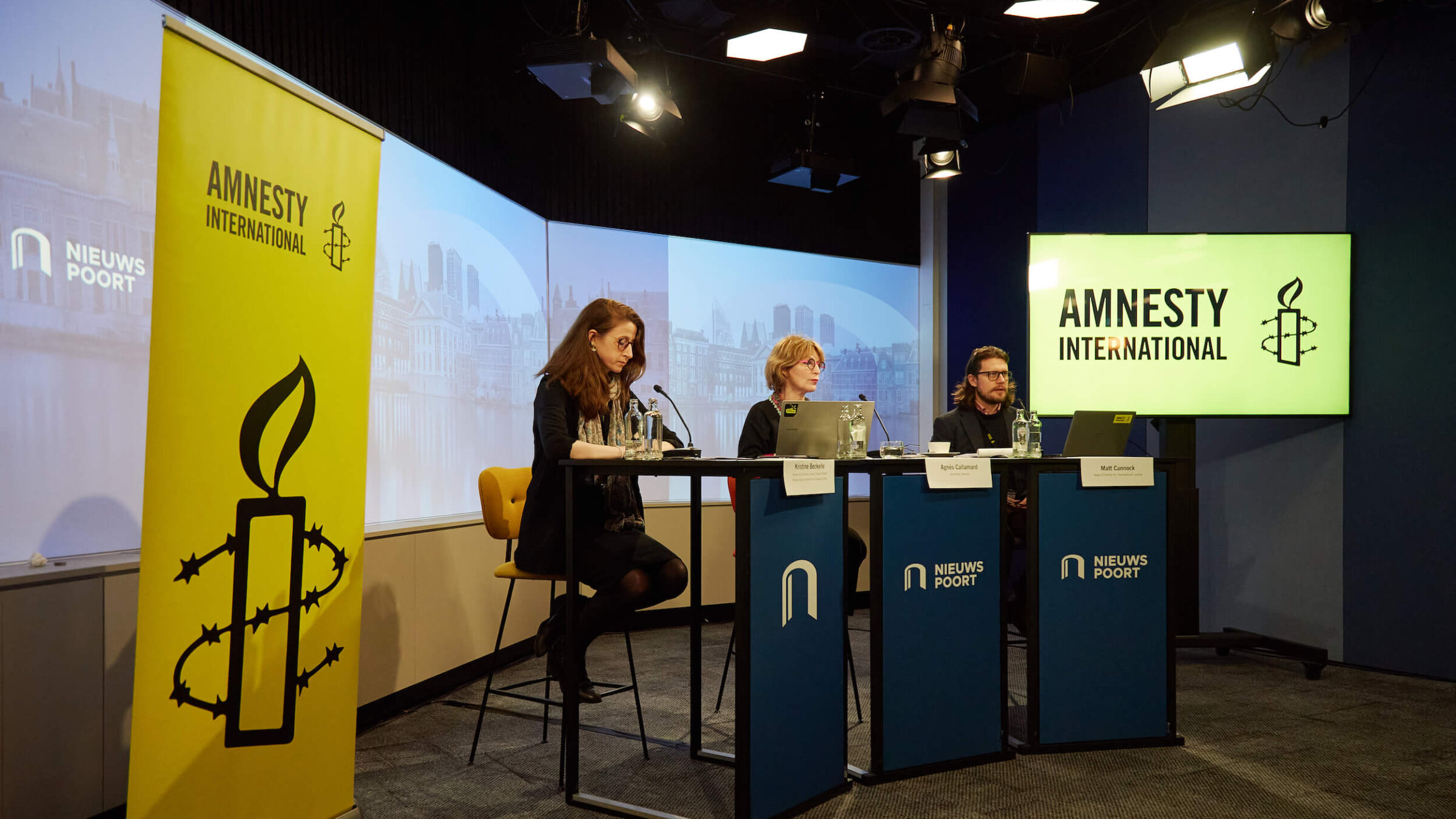 Amnesty International officers present the group's new report alleging genocide by Israel in Gaza on Dec. 4.