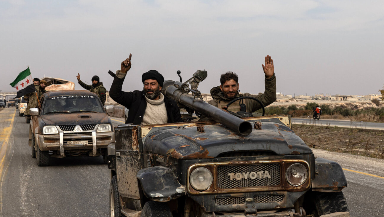 Syrian rebels celebrate their victories in a lightning-quick toppling of Bashar al-Assad's regime.