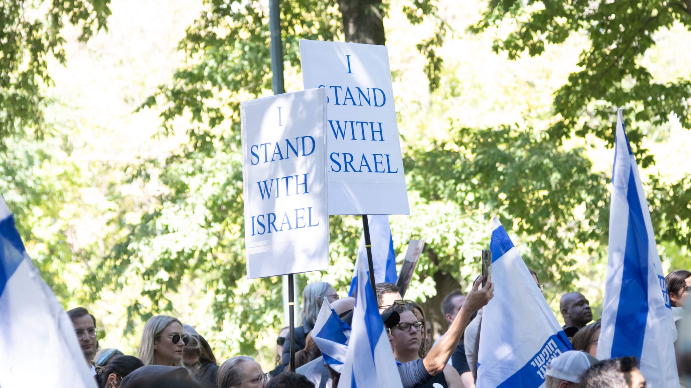 People hold signs that read, "I stand with Israel" during a New York City rally to mark the first anniversary of the Oct. 7 terror attacks on Israel. 