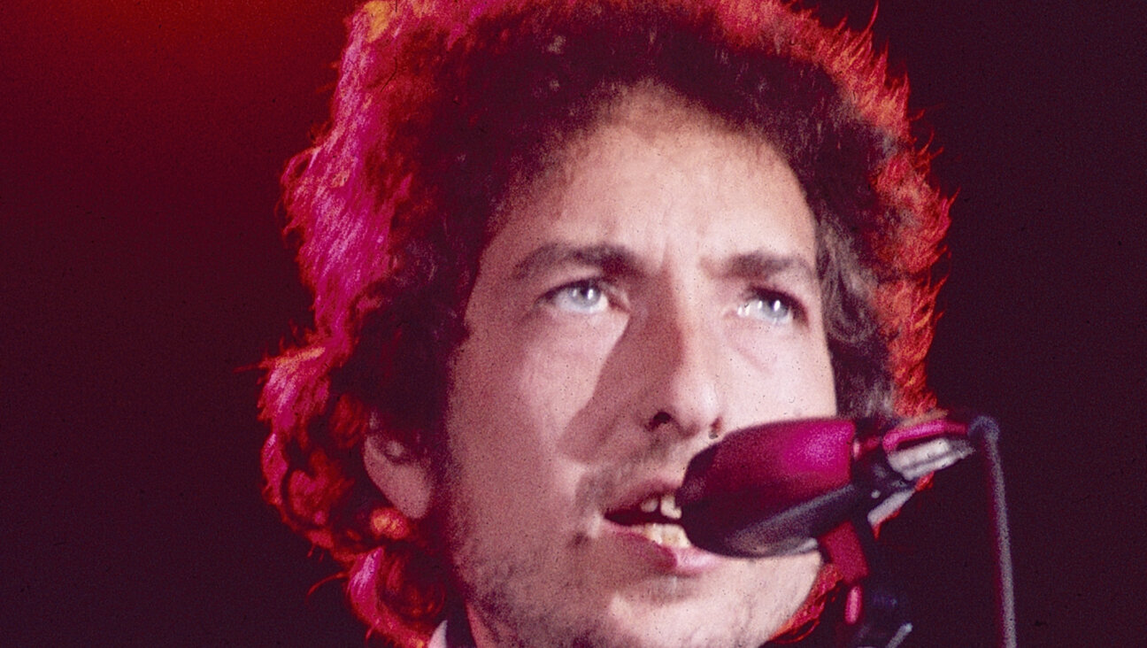 Bob Dylan performs with The Band in 1974, one year before the release of 'Blood on the Tracks.'