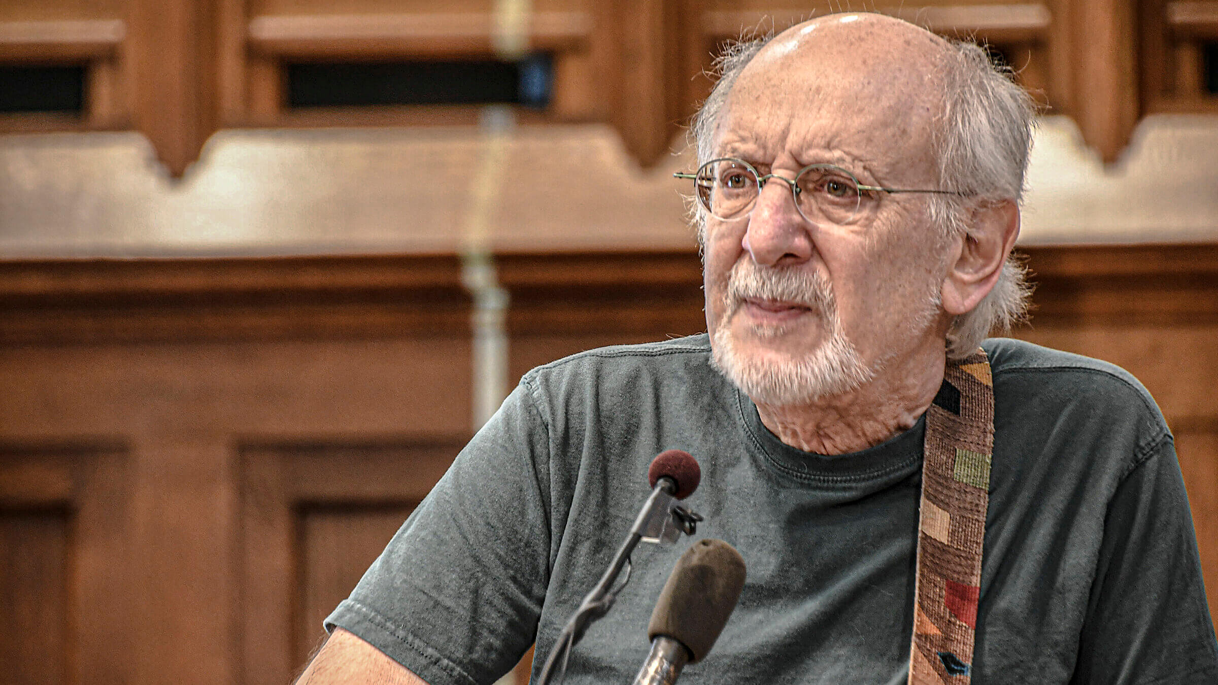 Peter Yarrow plays acoustic guitar as he performs in 2017 during a Vietnam peace commemoration.