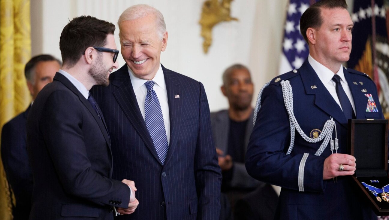 Alex Soros, son of philanthropist George Soros, greets U.S. President Joe Biden before being presented the Presidential Medal of Freedom on behalf of his father in the East Room of the White House, Jan. 4, 2025. (Tom Brenner/Getty Images)