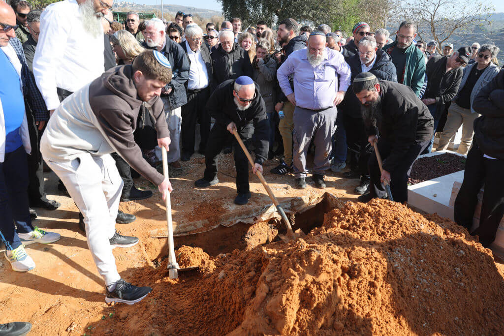 Friends help bury the body of Rachel Cohen, 73, an Israeli killed in a shooting by Palestinian gunmen in the occupied West Bank on Jan. 6, 2025.