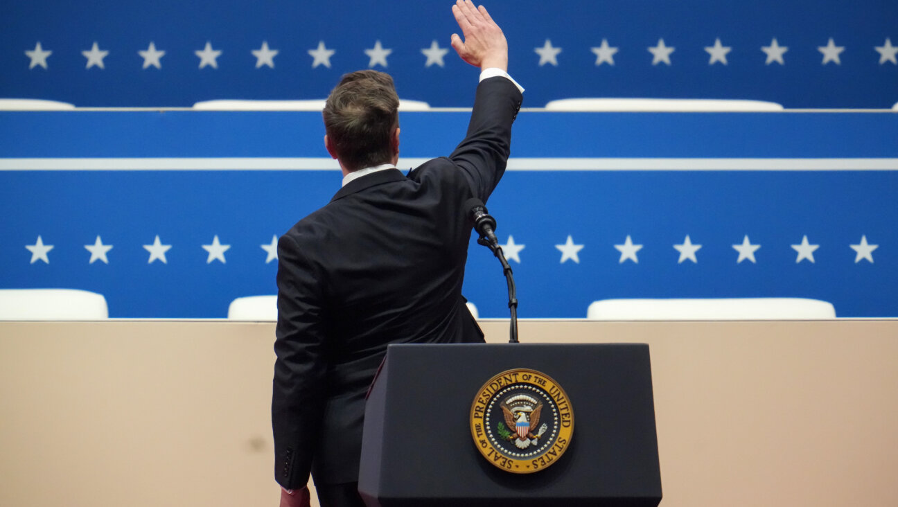 Elon Musk gestures while speaking during an inauguration event at Capital One Arena on Jan. 20, 2025.