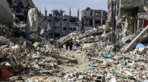 Palestinians walk along destroyed houses at the Shaboura area in the center of Rafah, days into the ceasefire agreement between Israel and Hamas, Jan 24, 2025.(Abed Rahim Khatib/dpa via Getty Images)