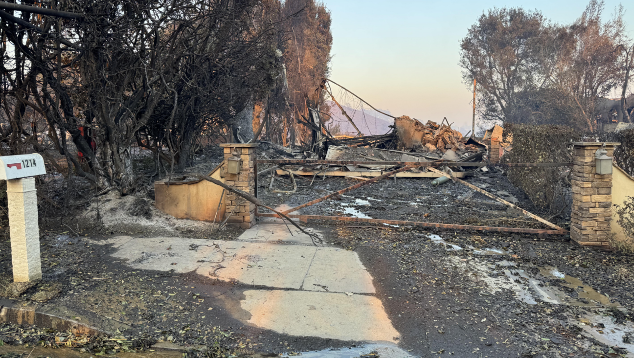 Dave and Jen Miner's home after the Los Angeles fires destroyed it last week. The Miners were all safe, but they many posessions, including the wedding contract that hang in their home for 31 years.