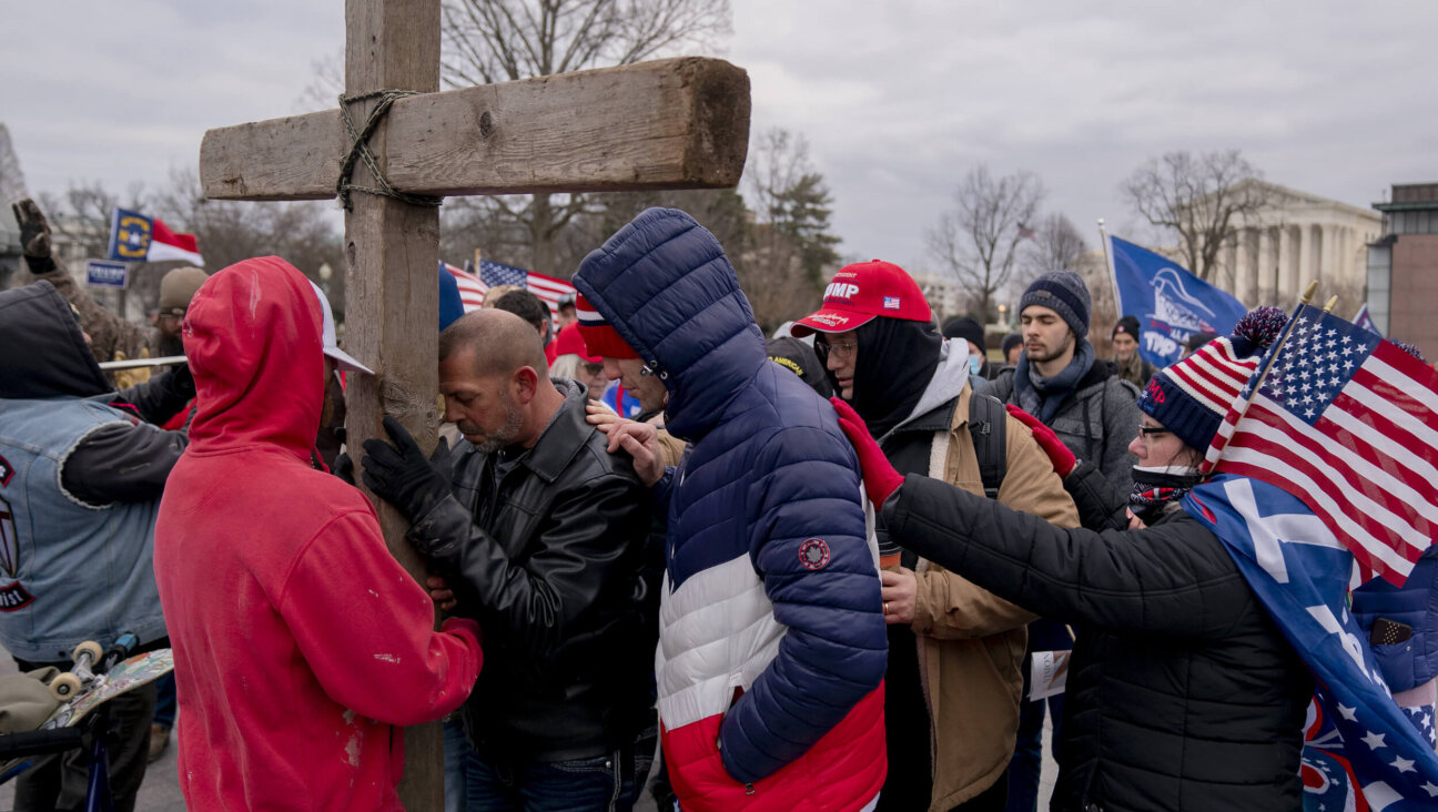 Demonstrators erect a wooden cross outside the U.S. Capitol in Washington, D.C., on Wednesday, Jan. 6, 2021. 