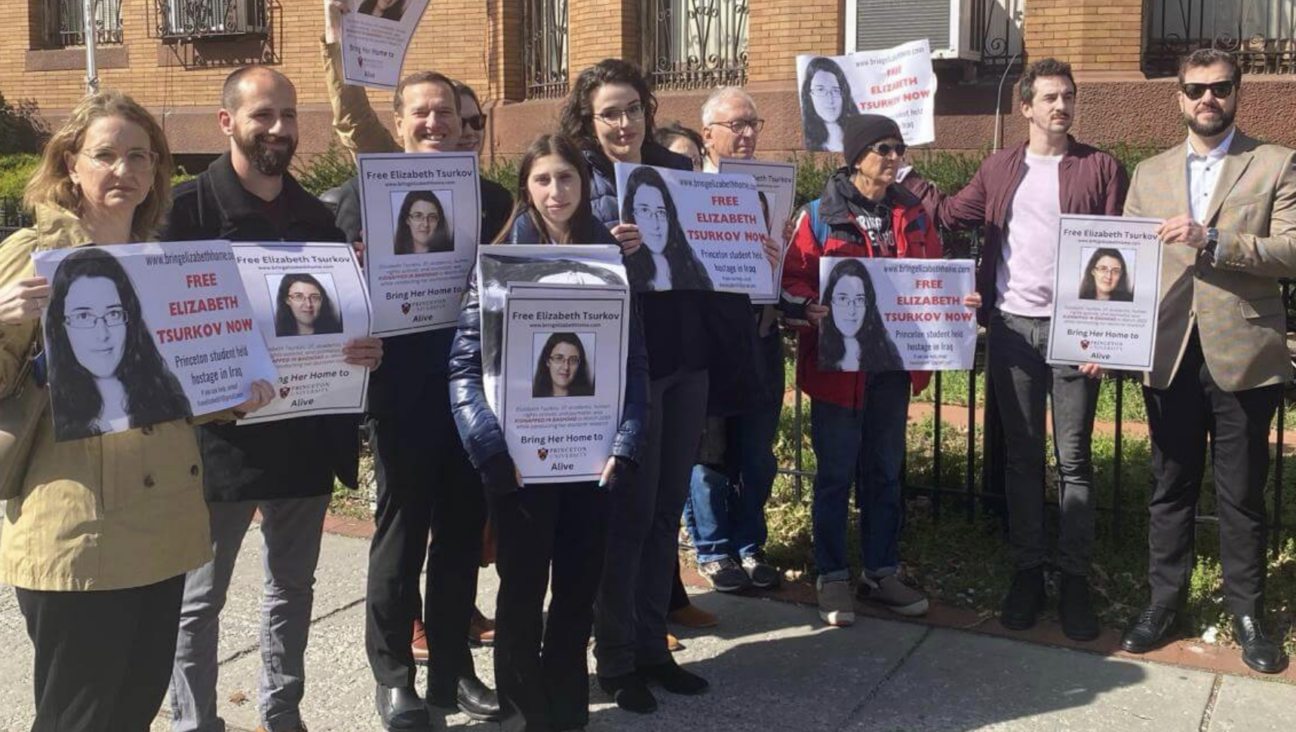 Emma Tsurkov, at center with glasses, led a protest outside the Iraqi embassy on March 21, 2024, exactly a year after her sister, Elizabeth, was kidnapped from a Baghdad cafe. 