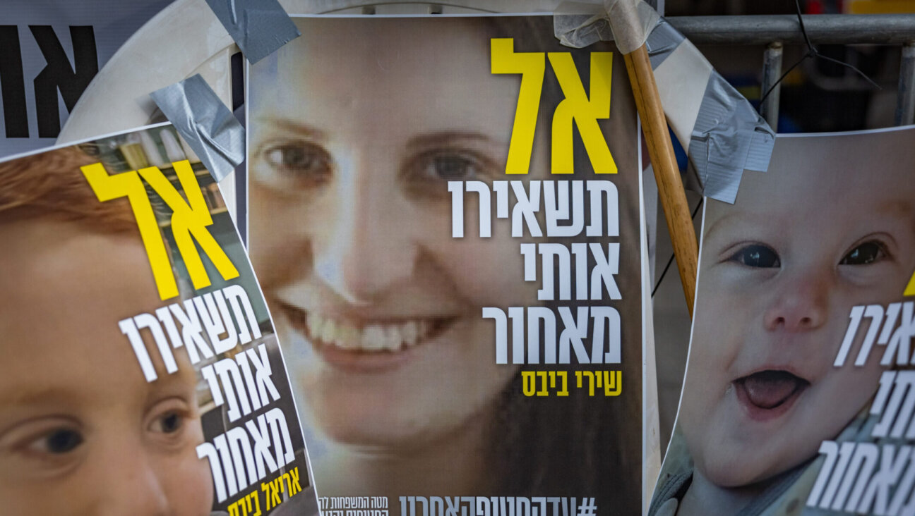 Pictures of Shiri Bibas and her children Kfir and Ariel who are held hostage in Hamas captivity hang outside the protest tent calling for the release of Israeli hostages in the Gaza Strip, outside the Prime Minister’s residence in Jerusalem, February 19, 2025. Photo by Chaim Goldberg/Flash90 *** Local Caption *** אריאל כפיר שירי ביבס בית ראש הממשלה משפחות חטופים מלחמה חרבות ברזל אוהל מחאה