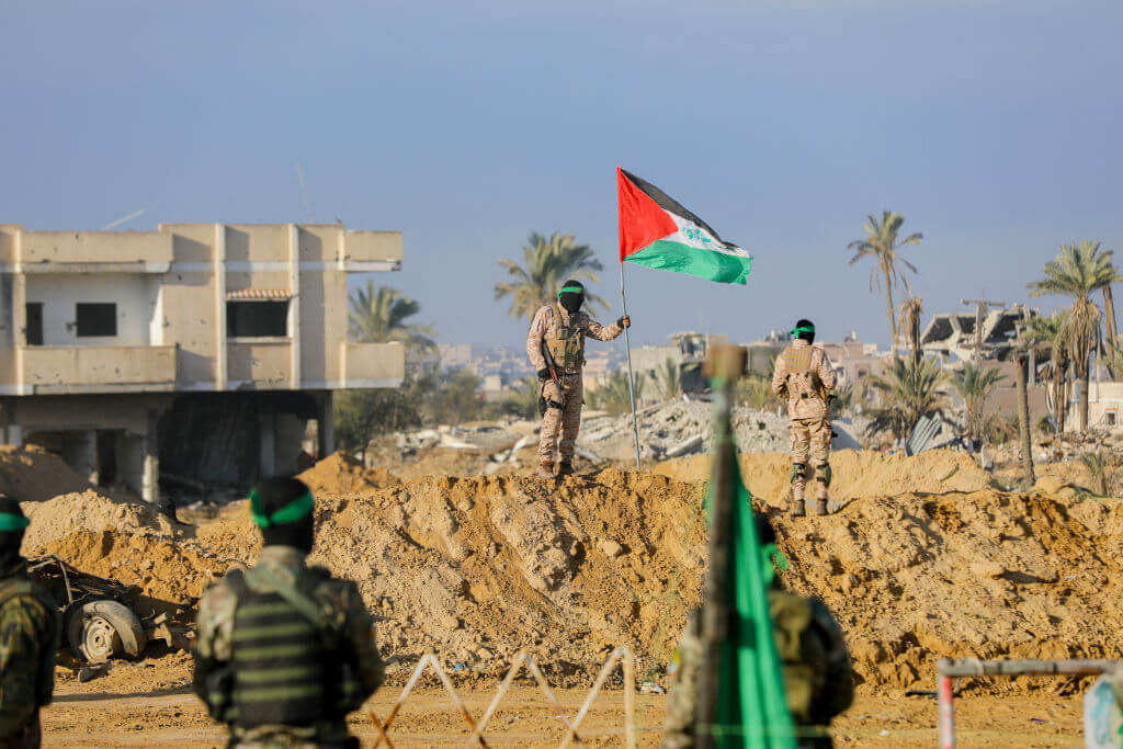 Al-Qassam Brigades, the armed wing of Hamas, stand guard in Khan Younis, Gaza, on February 1.