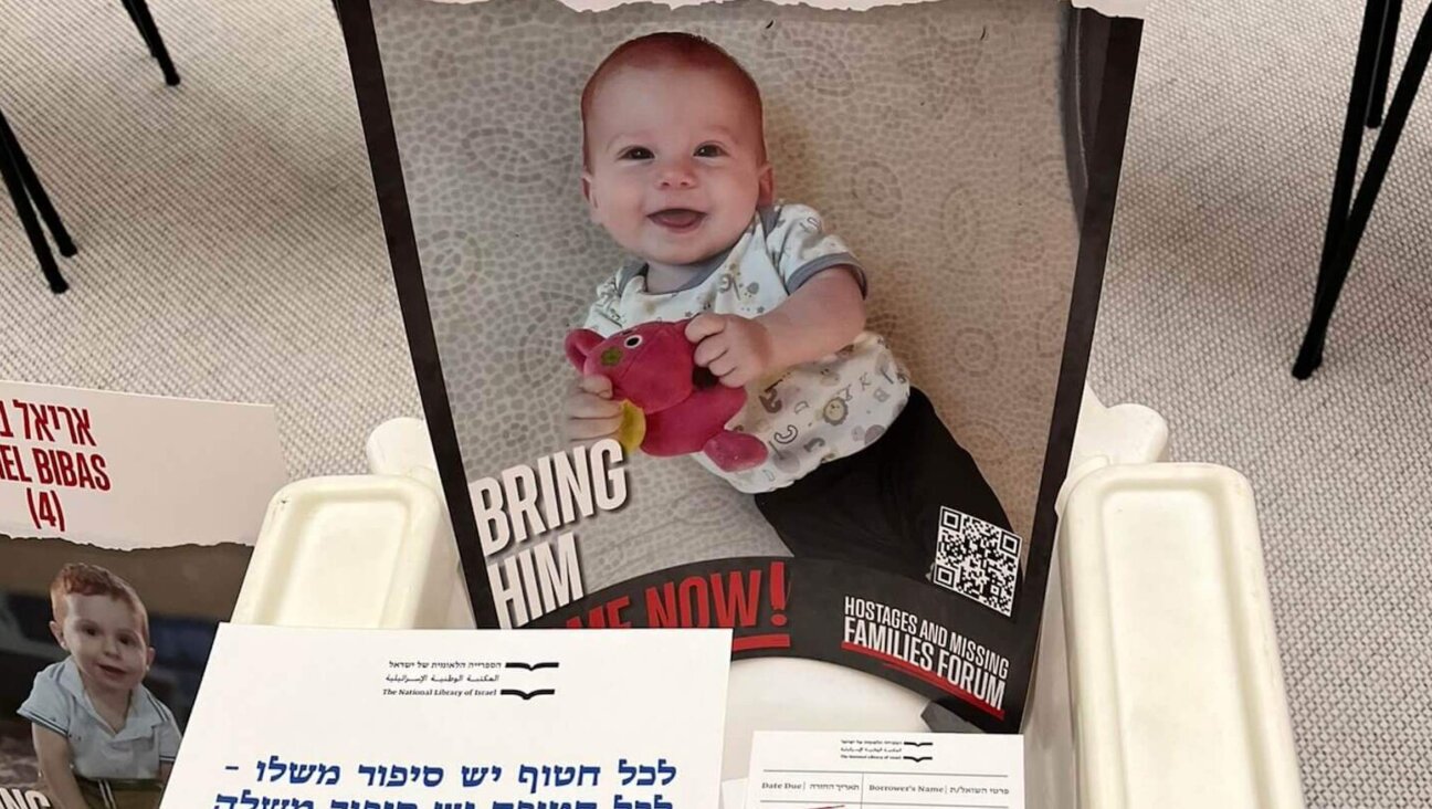 An empty chair and child’s book for Kfir Bibas were part of an exhibit at Israel’s National Library. 