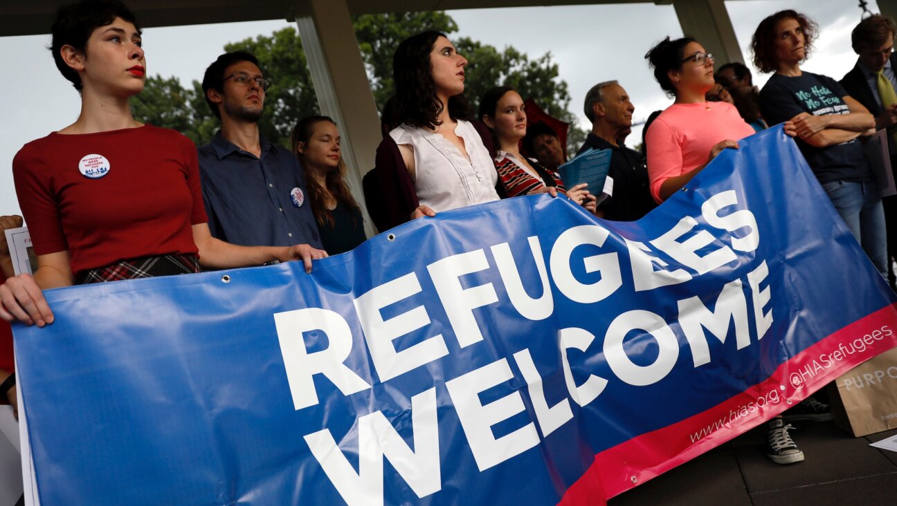 Activists hold a banner during a pro-refugee demonstration organized by HIAS outside the U.S. Capitol, Sept. 14, 2017. (Aaron P. Bernstein/Getty Images)