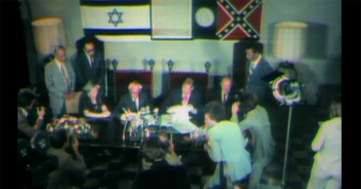 Leaders of Israel and the state of Georgia sign documents to switch places in a sketch on the first episode of 'Saturday Night Live.'